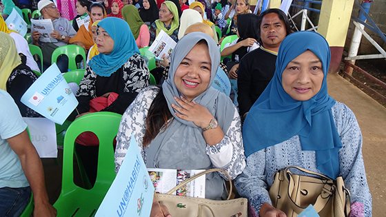 After heavy fighting destroyed their city, Filipino families come together for ground breaking at the site of their new homes