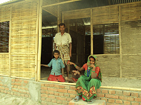 The family outside their new house